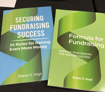 Two paperback books - on the left, with a blue and green cover: Securing Fundraising Success and on the right with a multitonal green cover: Formula for Fundraising.