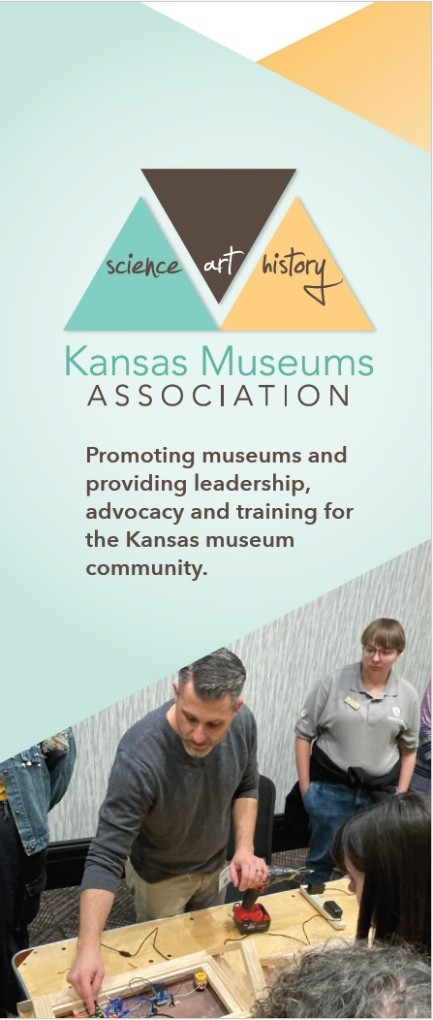 Image of the cover of the Kansas Museums Association informational brochure, with logo, image of a man leading a wiring workshop while others look on, and the text, "Promoting museums and providing leadership, advocacy, and training for the Kansas museum community."