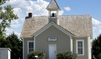 Image of a one room school with bell tower at Santa Fe Trail Center Museum & Research Library
