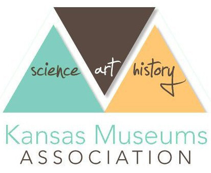 Kansas Museums Association logo with a teal triangle with the word science inside, an inverted brown triangle with the word art inside, and a sunflower yellow triangle with the word history inside.  A stylized white M runs between the triangles, and the words Kansas Museums Association appear below.